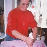 June 2016 volunteer Valda puts finishing touches on the homemade 11th anniversary cake