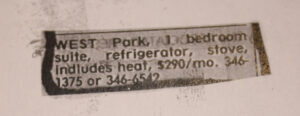 newspaper clipping of ad for 1 bedroom suite, pasted onto diary page