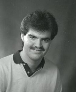 black and white image of smiling young man