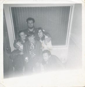 group shot of 2 young girls, one young boy and 2 older young men