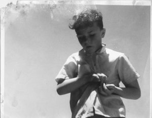 young boy against the sky