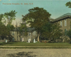 old building with woman wearing white dresses on grass