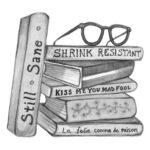 stack of books with a pair of glass on top