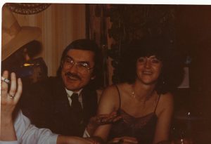 2 people at dinner function - man and women dressed up