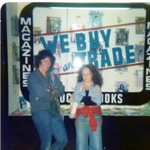 2 women standing outside department display window